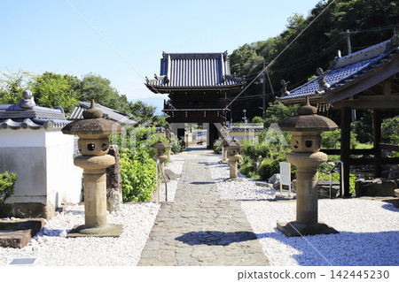 The 4th temple on the pilgrimage route, Kuroiwa-san Henjo-in Dainichi-ji, stands perched on a gentle mountain slope, offering a view of the bell tower gate from the main hall. The 4th temple on the pilgrimage route, Kuroiwa-san Henjo-in Dainichi-ji, stands perched on a gentle mountain slope, offering a view of the bell tower gate from the main hall. 142445230