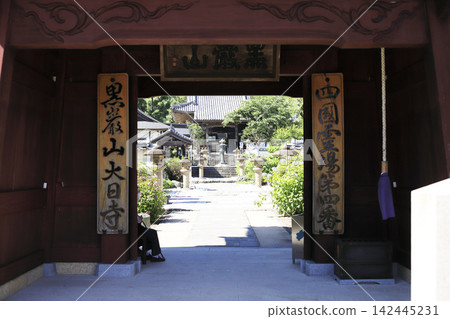 The bell tower gate of Dainichi-ji Temple, the fourth temple on the Shikoku Pilgrimage, stands quietly on a gentle mountain slope. The bell tower gate of Dainichi-ji Temple, the fourth temple on the Shikoku Pilgrimage, stands quietly on a gentle mountain slope. 142445231