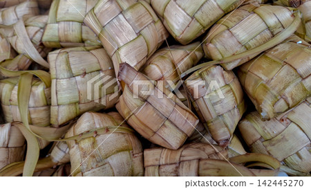 Close-Up of Handwoven Ketupat Rice Cakes in Palm Leaves Close-Up of Handwoven Ketupat Rice Cakes in Palm Leaves 142445270