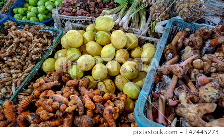 Fresh Galangal Rhizomes, Turmeric, and Leeks in Market Baskets Fresh Galangal Rhizomes, Turmeric, and Leeks in Market Baskets 142445273