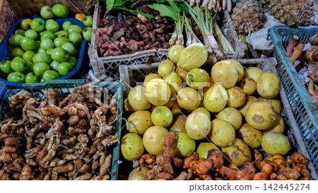 Close-Up of Limes, Turmeric Roots, and Other Fresh Produce in Market Close-Up of Limes, Turmeric Roots, and Other Fresh Produce in Market 142445274