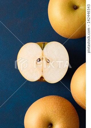 Pear cut in half; Akizuki variety from Chiba Prefecture. Pear cut in half; Akizuki variety from Chiba Prefecture. 142446343