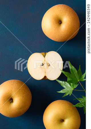 Pear cut in half; Akizuki variety from Chiba Prefecture. Pear cut in half; Akizuki variety from Chiba Prefecture. 142446349
