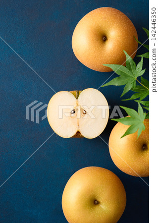 Pear cut in half; Akizuki variety from Chiba Prefecture. Pear cut in half; Akizuki variety from Chiba Prefecture. 142446350