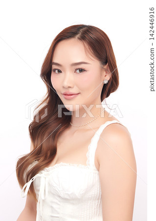 A beautiful young Asian woman with clean, fresh skin against a white background. Skincare, facial treatment, cosmetology, beauty, and spa. An elegant portrait of an Asian woman. A beautiful young Asian woman with clean, fresh skin against a white background. Skincare, facial treatment, cosmetology, beauty, and spa. An elegant portrait of an Asian woman. 142446916