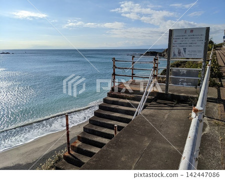 A nostalgic concrete staircase along the coast leads down to the clear blue sea. A nostalgic concrete staircase along the coast leads down to the clear blue sea. 142447086