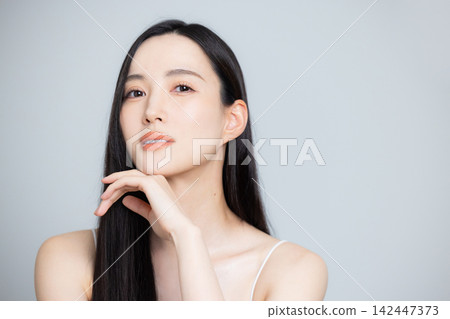Beauty image of a woman with long hair Beauty image of a woman with long hair 142447373