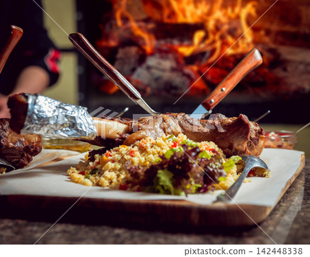 Cooking rice with meat Cooking rice with meat 142448338