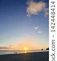 Sunset over the sea in Okinawa - Sunset Beach glowing in golden hues 142448414