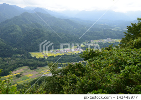 Shimogo Town, Fukushima Prefecture: The Aizu valley, surrounded by mountains in early autumn, awaits harvest. Shimogo Town, Fukushima Prefecture: The Aizu valley, surrounded by mountains in early autumn, awaits harvest. 142448977