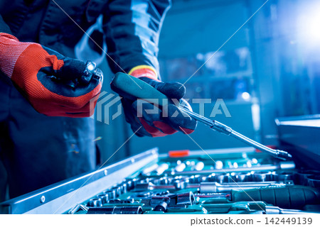 Tools at the hands. Auto repair Tools at the hands. Auto repair 142449139