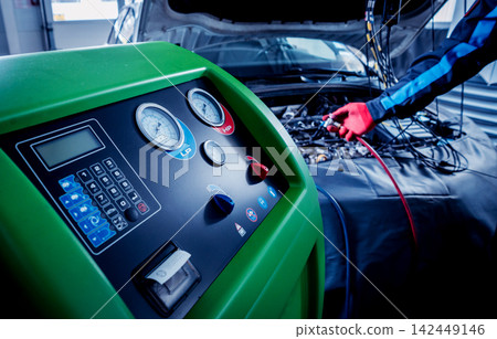 Servicing car air conditioner. Service station. 142449146