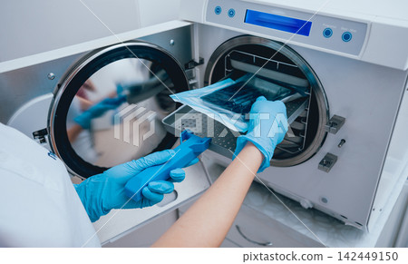 Sterilizing medical instruments in autoclave Sterilizing medical instruments in autoclave 142449150