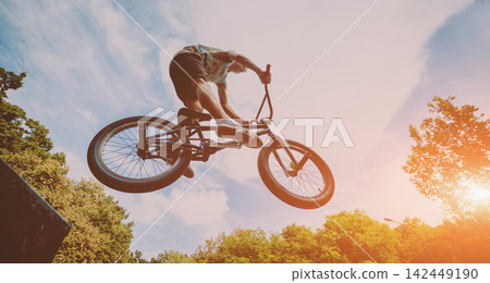 Boy jumping with his bmx in the park. Boy jumping with his bmx in the park. 142449190