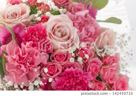 A gorgeous bouquet of pink roses, carnations, and baby's breath. A gorgeous bouquet of pink roses, carnations, and baby's breath. 142450710