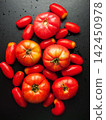 Red ripe fresh organic tomatoes on background splashed with water, healthy nutritious vegetables 142450978