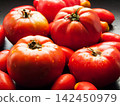 Red ripe fresh organic tomatoes on background splashed with water, healthy nutritious vegetables 142450979