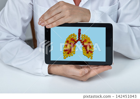 Medical doctor presenting an artistic floral illustration of healthy human lungs on a tablet screen during a pulmonary health consultation Medical doctor presenting an artistic floral illustration of healthy human lungs on a tablet screen during a pulmonary health consultation 142451043