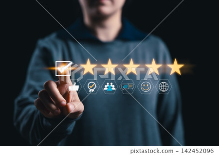 Customer Review and Five Star Rating Concept. Woman selecting five star rating with approval icons, representing positive feedback, customer satisfaction, service quality and trusted review results. Customer Review and Five Star Rating Concept. Woman selecting five star rating with approval icons, representing positive feedback, customer satisfaction, service quality and trusted review results. 142452096
