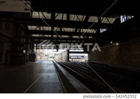 Empty train station platform in Perth, Scotland with railway tracks and infrastructure Empty train station platform in Perth, Scotland with railway tracks and infrastructure 142452352