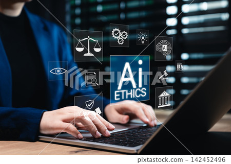 AI Ethics and Responsible Artificial Intelligence Governance Concept. Person using laptop with icons for AI ethics, regulations, law, fairness, transparency, data protection, privacy, and practices. 142452496