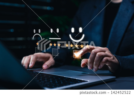 Customer satisfaction feedback and rating concept. Businesswoman selecting five star happy face rating on survey interface representing customer satisfaction, feedback, user experience, review process Customer satisfaction feedback and rating concept. Businesswoman selecting five star happy face rating on survey interface representing customer satisfaction, feedback, user experience, review process 142452522