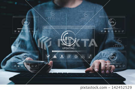 Software update and cybersecurity concept. User operating keyboard and smartphone with progress interfaces, system maintenance, data protection, installation, network security, automation, IT workflow 142452529