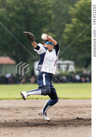 A high school girl who plays pitcher in girls' softball. A high school girl who plays pitcher in girls' softball. 142453205