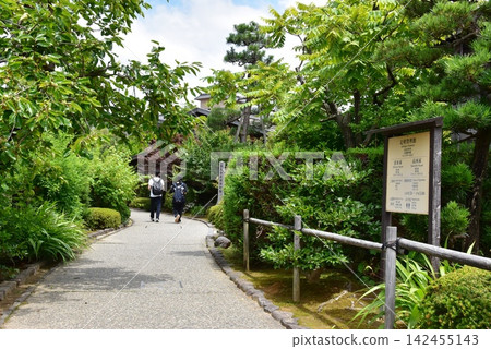 Kanazawa City: Walking path along the Ohno-sho irrigation canal, sign for the Ashigaru Museum, and deep greenery. Kanazawa City: Walking path along the Ohno-sho irrigation canal, sign for the Ashigaru Museum, and deep greenery. 142455143