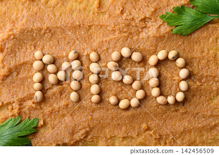 MISO alphabet made from soybean seeds on miso paste background MISO alphabet made from soybean seeds on miso paste background 142456509