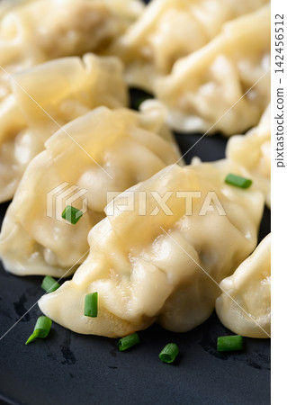 Close-up of dumpling stuffed with minced pork, Asian food Close-up of dumpling stuffed with minced pork, Asian food 142456512