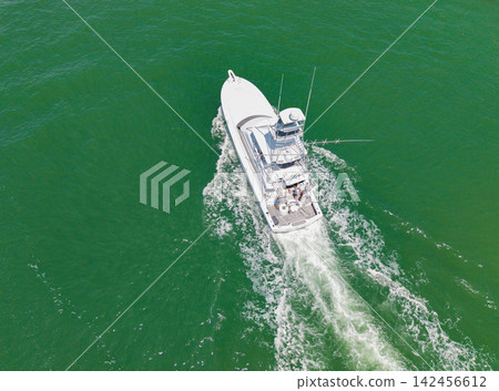 Boat motor aerial. Vacation on summer. Aerial view motorboat. Yacht boat tour. Luxury boat yachting. Motorboat at sea. Luxury private yacht in sea. Motor yacht luxury vessel. Luxury yacht vacation Boat motor aerial. Vacation on summer. Aerial view motorboat. Yacht boat tour. Luxury boat yachting. Motorboat at sea. Luxury private yacht in sea. Motor yacht luxury vessel. Luxury yacht vacation 142456612