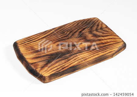 Charred wooden cutting board with rich grain texture on white background 142459054