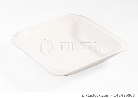 White square ceramic plate with subtle texture on white background White square ceramic plate with subtle texture on white background 142459068