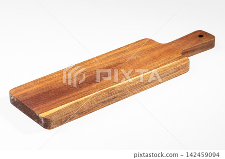 Wooden cutting board with handle on white background Wooden cutting board with handle on white background 142459094