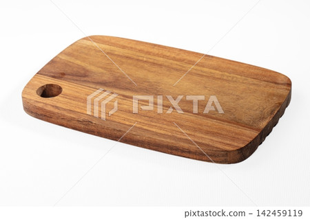 Wooden cutting board with rounded edges and handle hole on white background Wooden cutting board with rounded edges and handle hole on white background 142459119