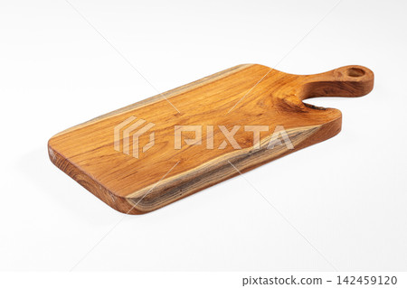 Wooden cutting board with natural grain and handle on white background Wooden cutting board with natural grain and handle on white background 142459120