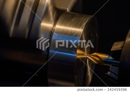 Pilot drilling process on metal shaft parts using a coated center drill tool on a lathe machine Pilot drilling process on metal shaft parts using a coated center drill tool on a lathe machine 142459396