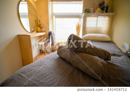 A beauty treatment room bathed in soft light. A beauty treatment room bathed in soft light. 142459712