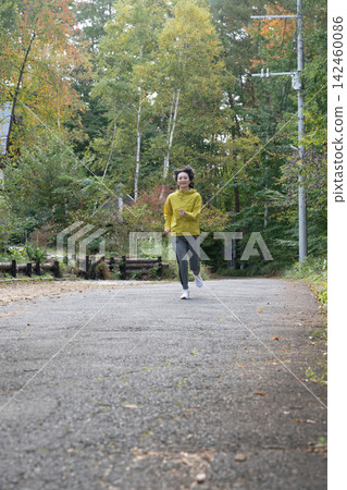 Middle-aged and elderly female runners running in the highlands; running, jogging Middle-aged and elderly female runners running in the highlands; running, jogging 142460086