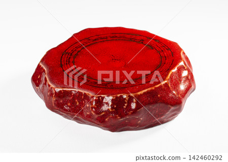 Red ceramic plate with textured glaze and concentric rings Red ceramic plate with textured glaze and concentric rings 142460292