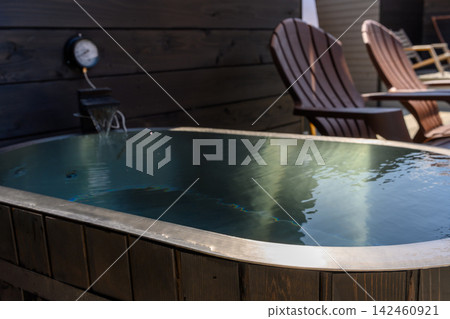 Open-air bath and relaxing deck chairs Open-air bath and relaxing deck chairs 142460921
