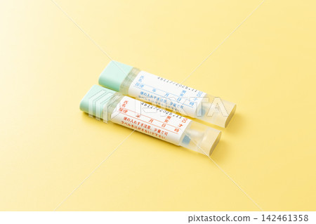 Stool sample kit for colorectal cancer on a yellow background Stool sample kit for colorectal cancer on a yellow background 142461358