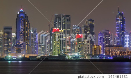 Dubai Marina skyline day to night timelapse as seen from Palm Jumeirah in Dubai, UAE. Dubai Marina skyline day to night timelapse as seen from Palm Jumeirah in Dubai, UAE. 142461581