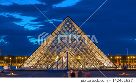 The Louvre museum pyramid after sunset day to night timelapse in Paris, France The Louvre museum pyramid after sunset day to night timelapse in Paris, France 142461627