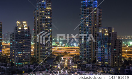 Dubai Marina skyscrapers aerial day to night timelapse, port with luxury yachts and marina promenade Dubai Marina skyscrapers aerial day to night timelapse, port with luxury yachts and marina promenade 142461659