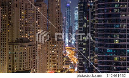 Evening illumination of Dubai Marina day to night aerial timelapse, UAE. Evening illumination of Dubai Marina day to night aerial timelapse, UAE. 142461662