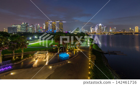 Singapore skyline panorama near Gardens by the bay with cloud forest, flower dome and supertrees day to night timelapse after sunset Singapore skyline panorama near Gardens by the bay with cloud forest, flower dome and supertrees day to night timelapse after sunset 142461716