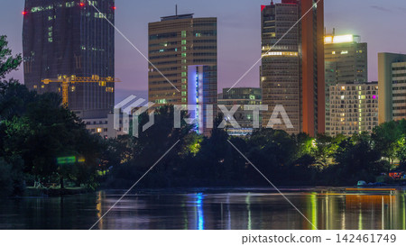 Vienna international center skyscrapers with Kaiserwasser lake reflection view day to night timelapse Vienna international center skyscrapers with Kaiserwasser lake reflection view day to night timelapse 142461749