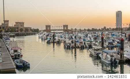 Yachts and boats at the Sharq Marina night to day timelapse in Kuwait. Kuwait City, Middle East Yachts and boats at the Sharq Marina night to day timelapse in Kuwait. Kuwait City, Middle East 142461831